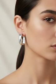 Close-up model wearing the earrings