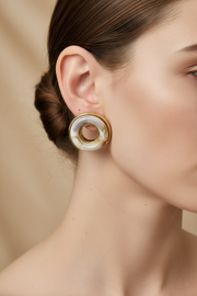 Close-up of the earrings on a model
