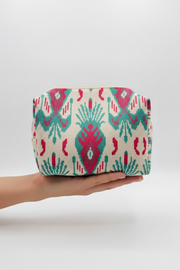 Front view hand holding ikat mini bag