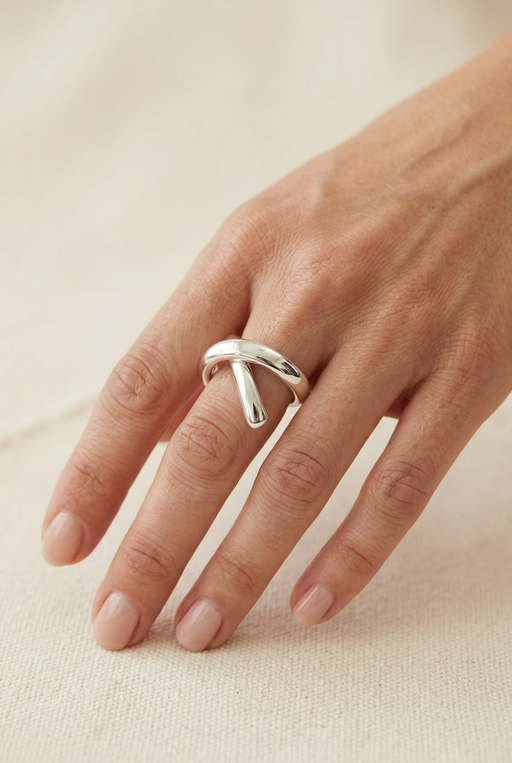Hand model wearing the sculptural silver ring