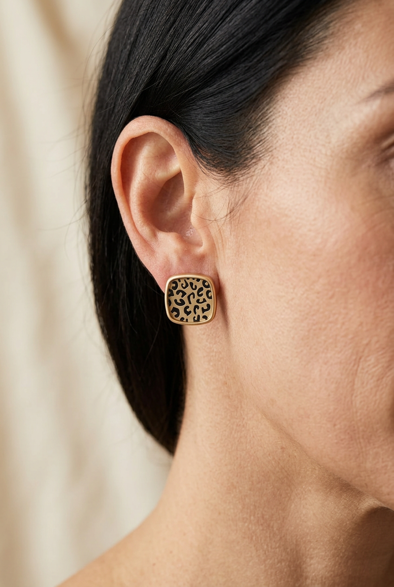 Model close-up wearing the rounded-square leopard-print earrings
