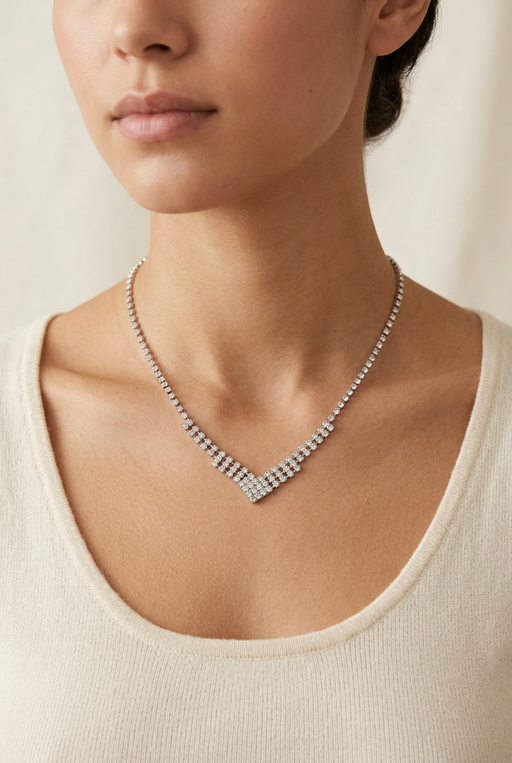 Young adult model wearing the silver-tone crystal necklace in close-up